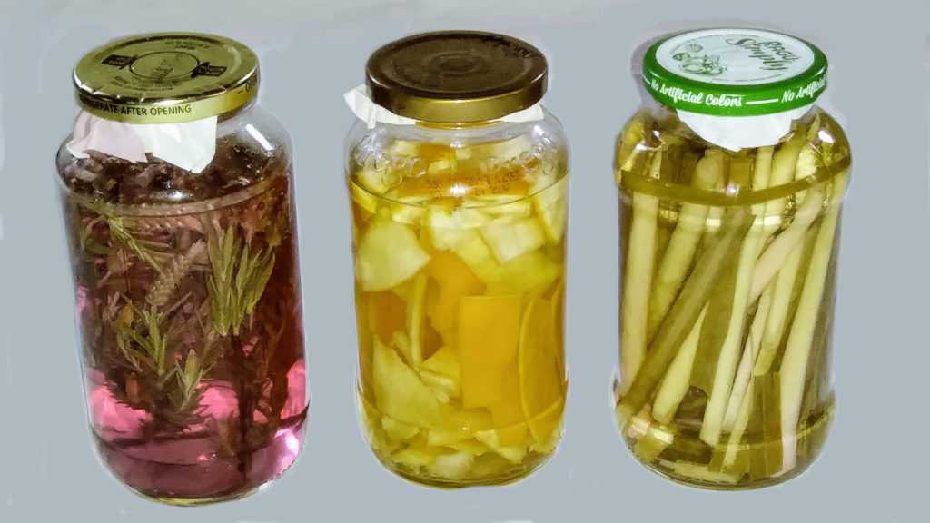 Three different scent infused cleaning vinegars
